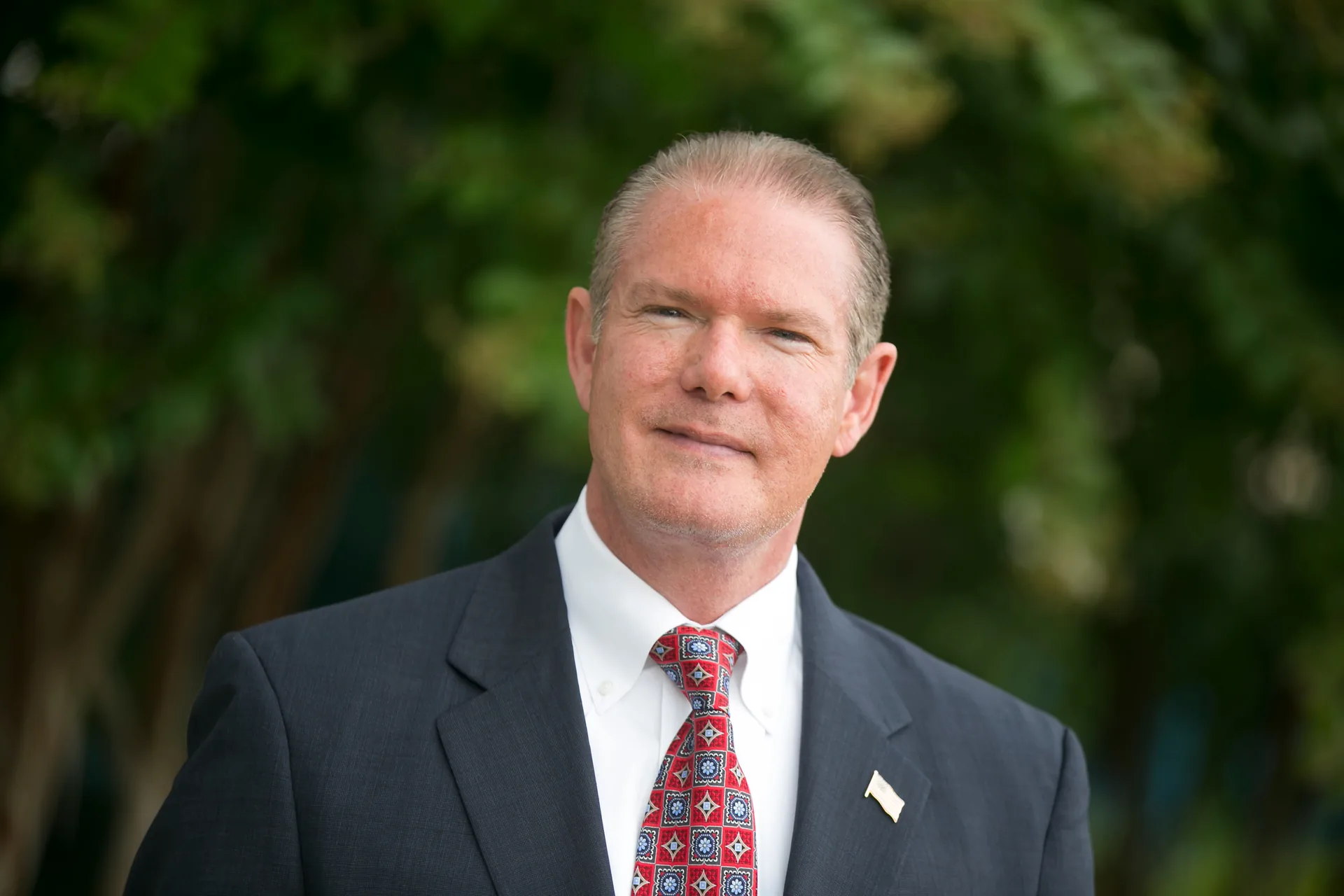 Historical portrait of Donnie Downs in a suit and tie during his business career
